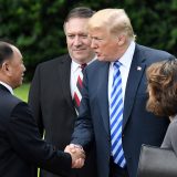 Tramp i Kim Džong Un 12. juna 12