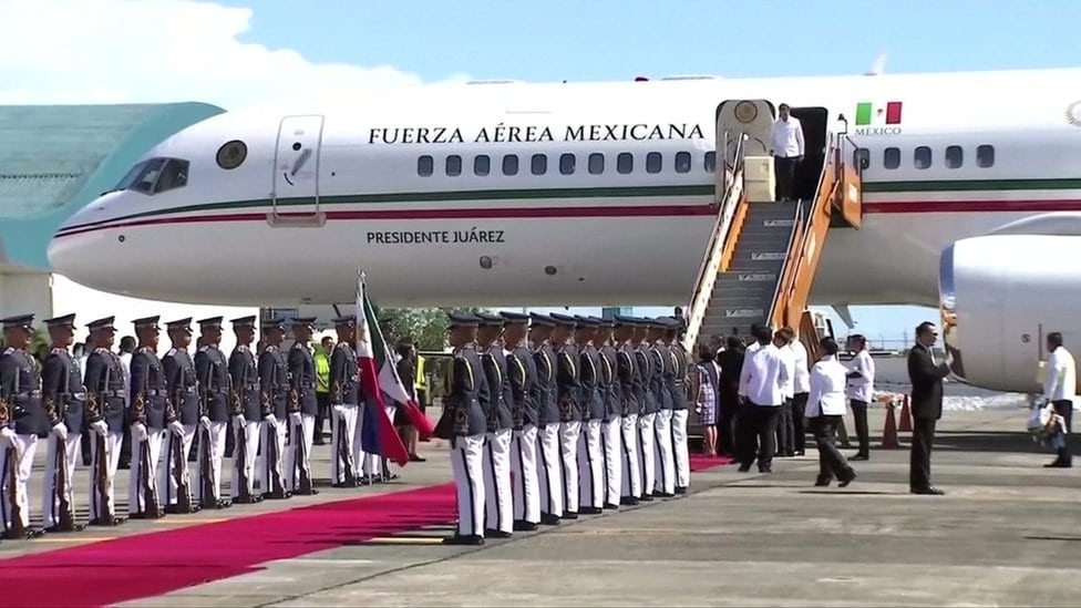 Mexico's President-elect Andrés Manuel López Obrador departs the commercial plane on Wednesday