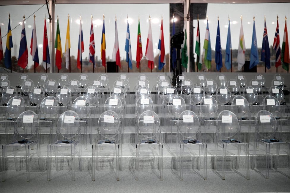 The empty chairs with the names of guests are seen before a commemoration ceremony for Armistice Day