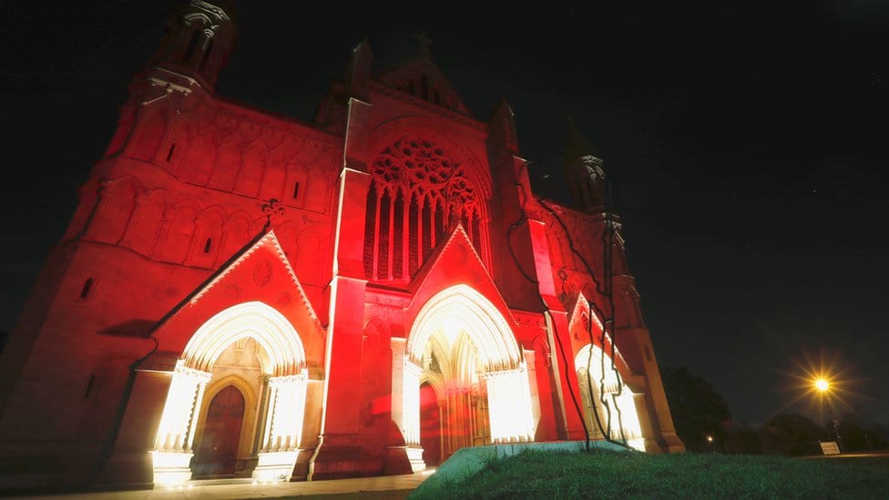 St Albans Cathedral is bathed in red light