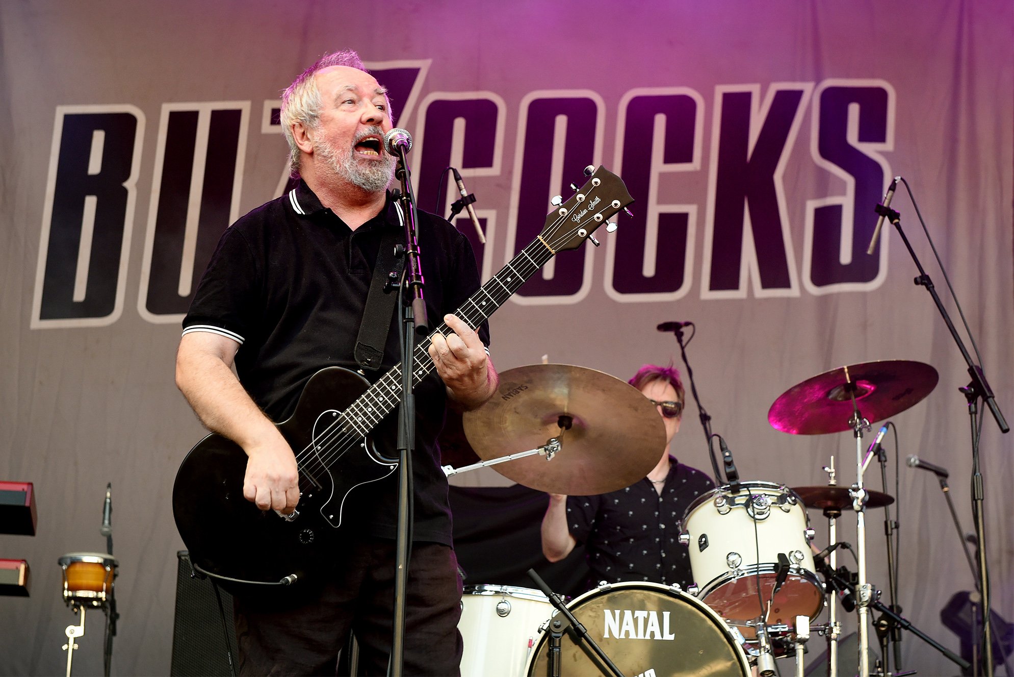 Pete Shelley of Buzzcocks performs during Sounds of the City at Castlefield Bowl on July 6, 2018 in Manchester