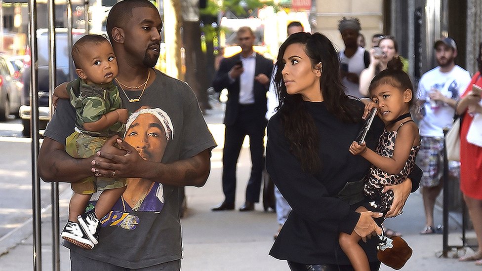 Kanye West and Kim Kardashian with children Saint and North