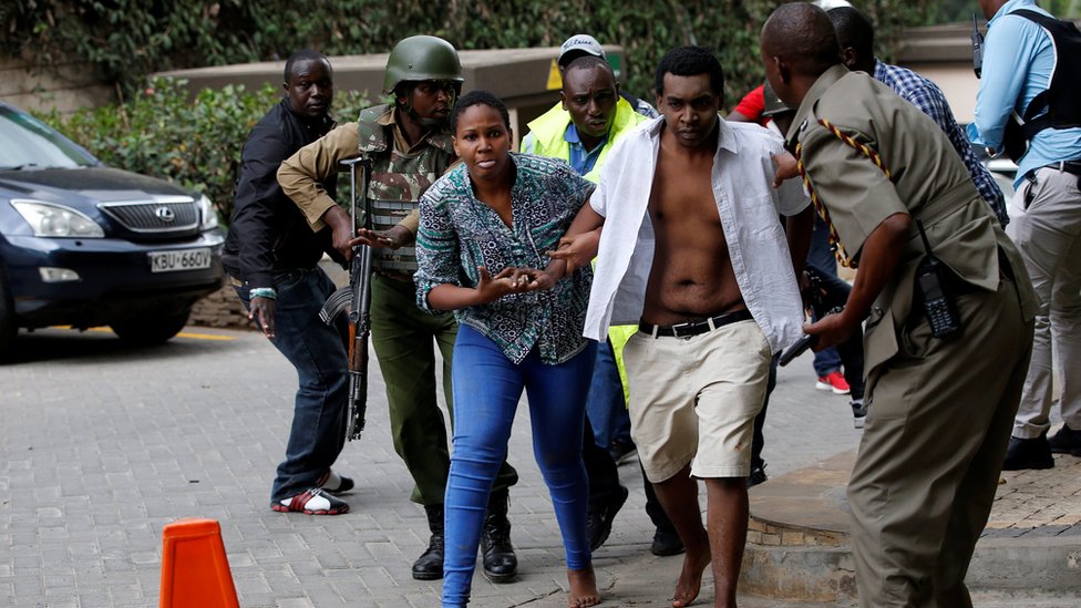 People are evacuated at the scene at the Dusit hotel compound in Nairobi, Kenya
