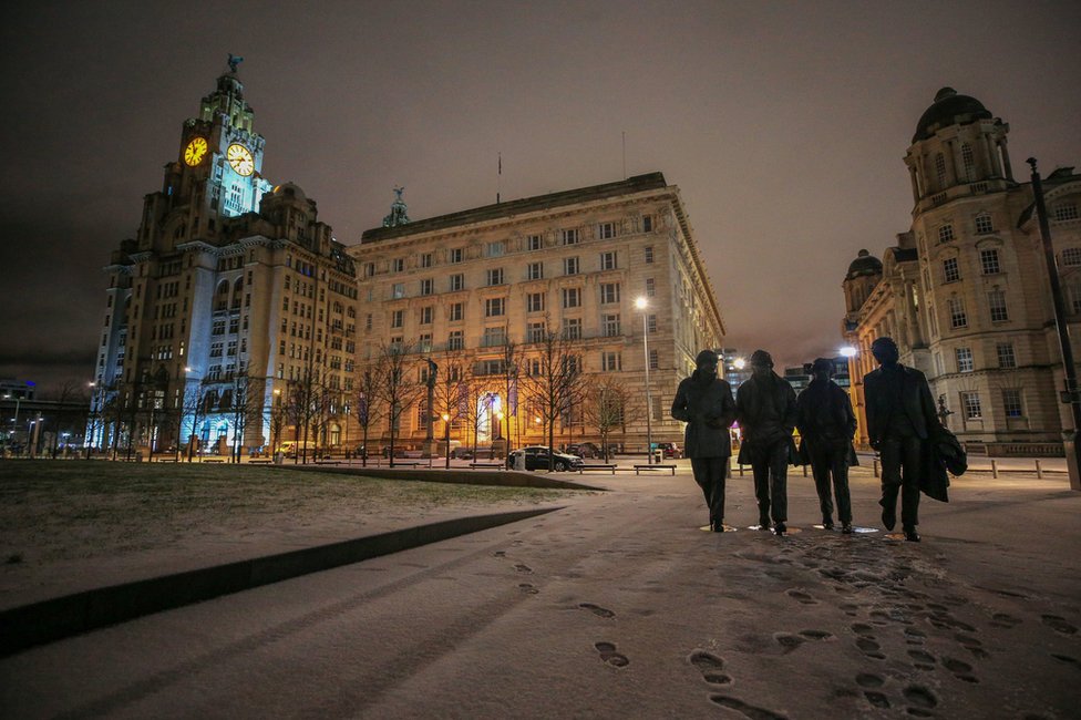 Overnight snow surrounds the statue of the Beatles in Liverpool
