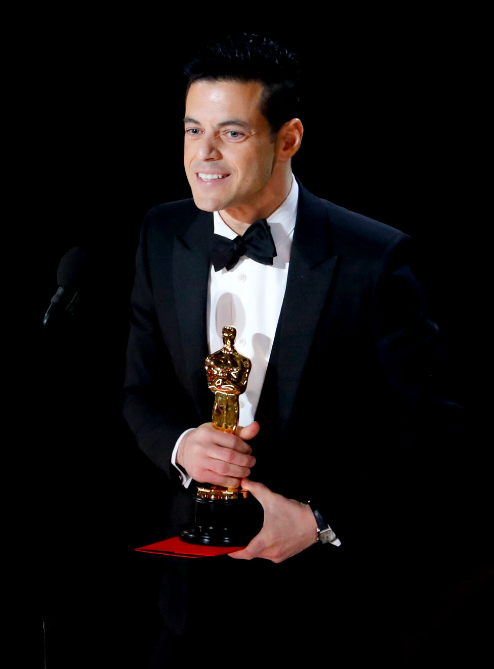 Rami Malek accepts the Best Actor award
