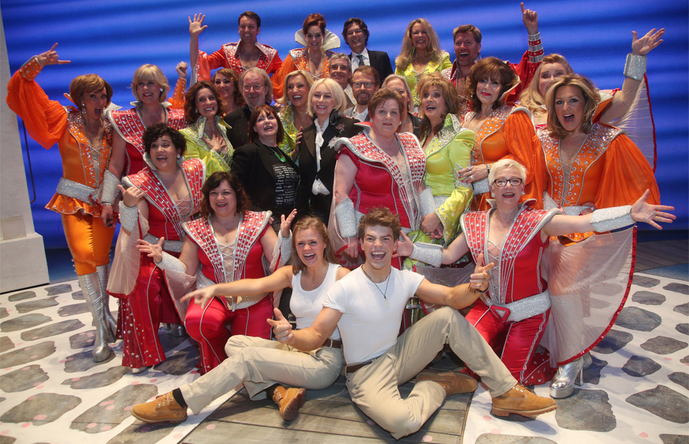 Theatre producer Judy Craymer (centre) is flanked by Benny Andersson (centre left) and Bjorn Ulvaeus (centre right), along with the cast and crew - including 12 former Dynamos - during the finale of the musical Mamma Mia!