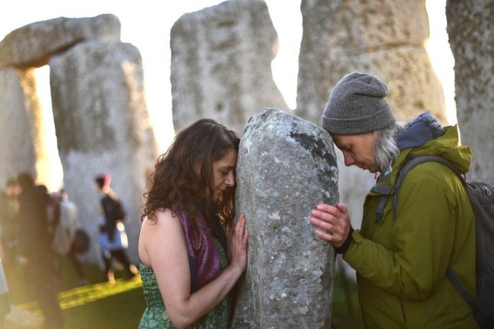 Two people at Stonehenge