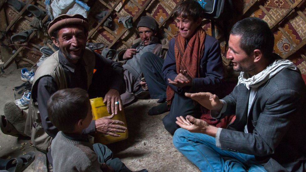 Wakhi nomads singing inside a yurt in Big Pamir, Afghanistan