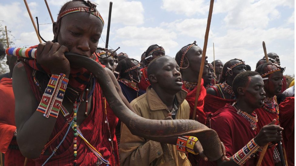 Maasai morans sing and dance during the ordination of a Maasai age-group leader