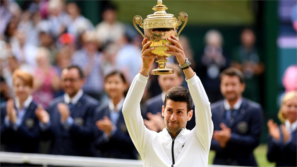 Novak Djokovic celebrates winning the Wimbledon men's singles title