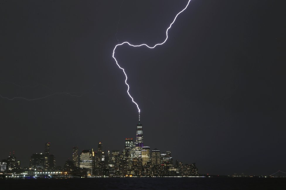 A lightning bolt strikes One World Trade Center in New York City.