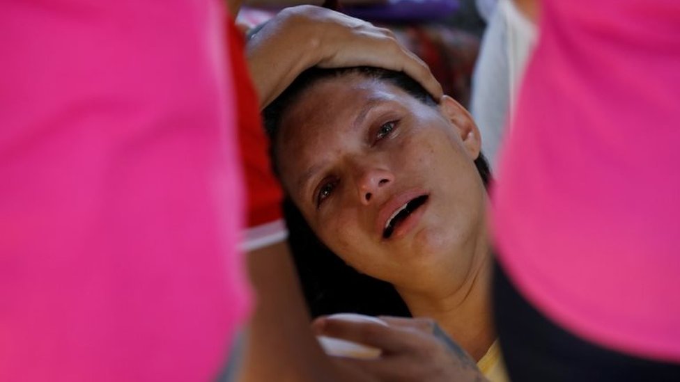 A relative of a prisoner cries in front of the Medical Legal Institute of Altamira, Brazil, July 30, 2019.