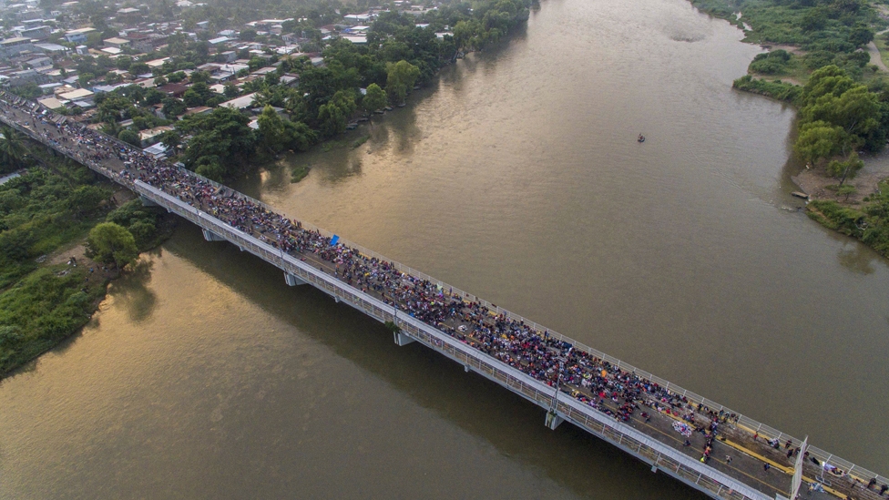 The migrant caravan crosses from Guatemala into Mexico, in October 2018