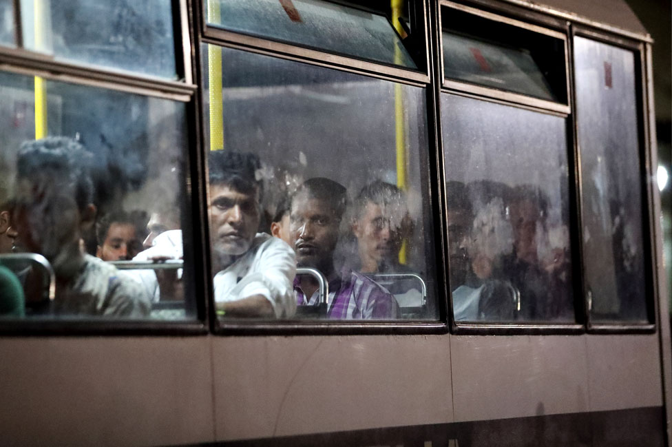 Migrants, rescued at sea by the Italian coastguard, are driven away on police buses after disembarking at the Armed Forces of Malta maritime base in Floriana, Malta. 17 September 2019