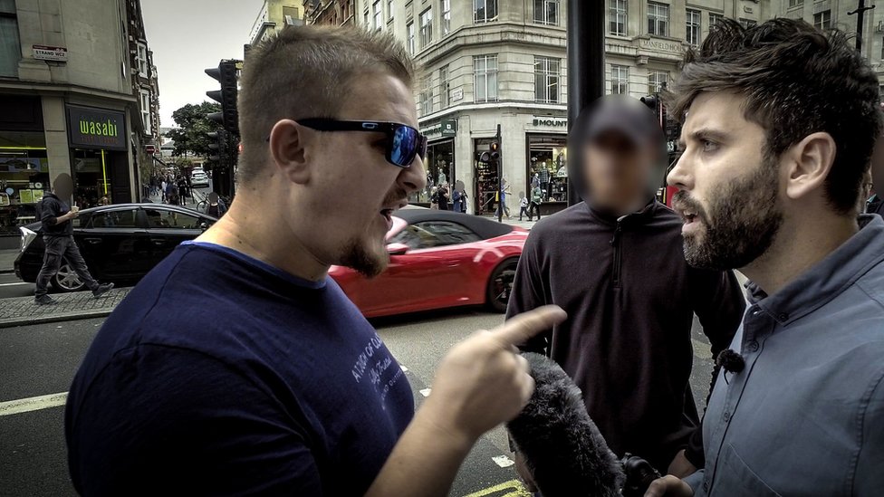 Screen grab from the documentary showing the reporter confronting Eddie