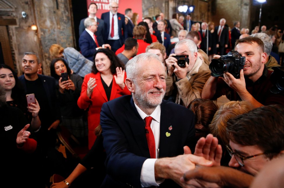 Britain's opposition Labour Party leader Jeremy Corbyn greets supporters