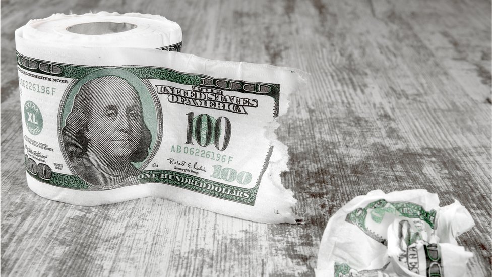 Toilet paper with a print of a $100 note
