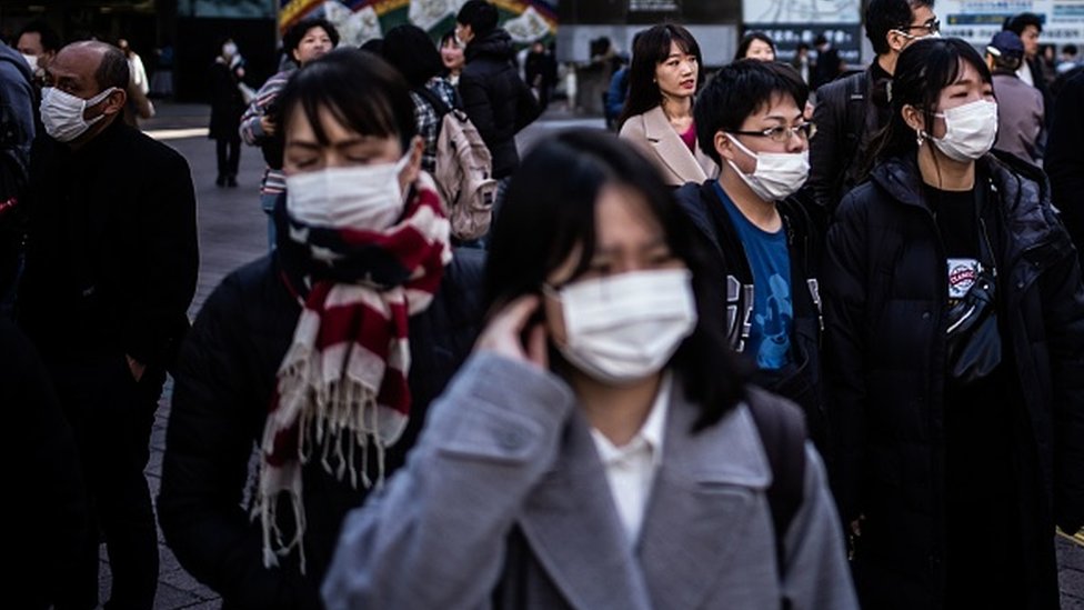 People wearing facemasks in Tokyo