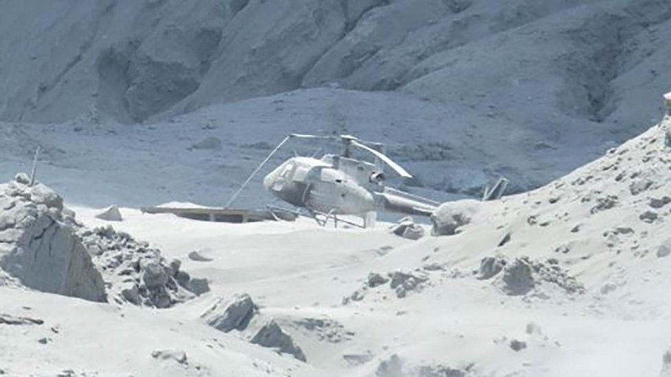 Helicopter covered in ash on White Island, 9 December