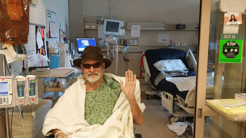 Tom saying goodbye to his hospital bed