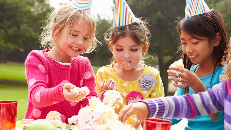 Children eating birthday cake