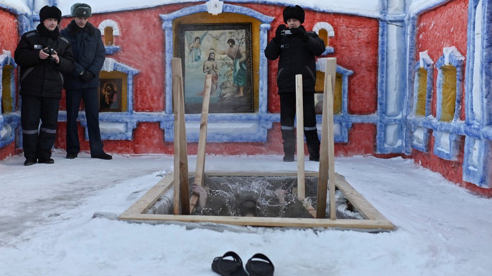 An inmate takes a dip at a high-security penal colony in Omsk, Russia