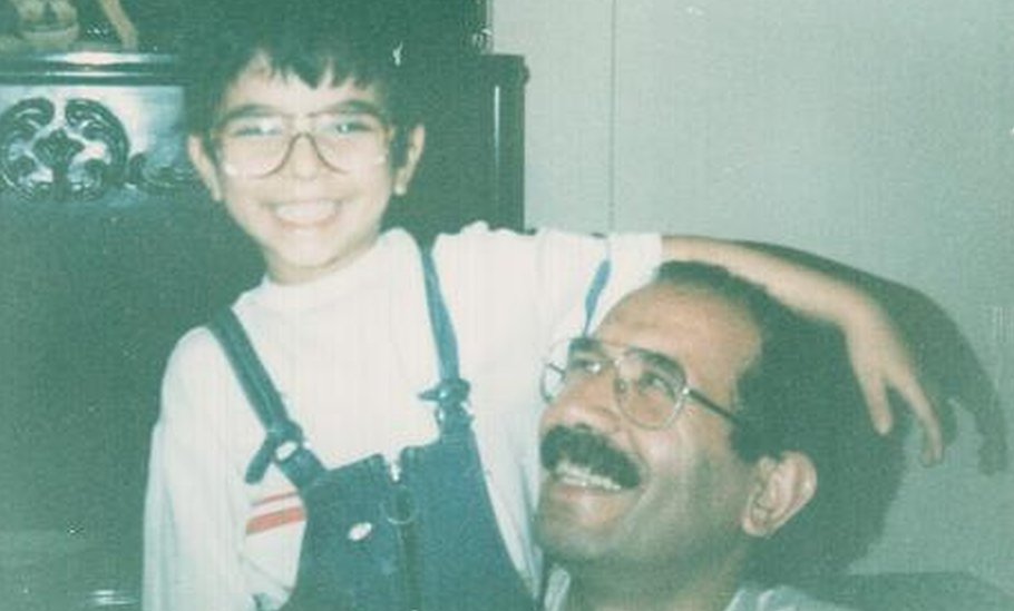 Sohrab sits with his father Mohammad Mokhtari