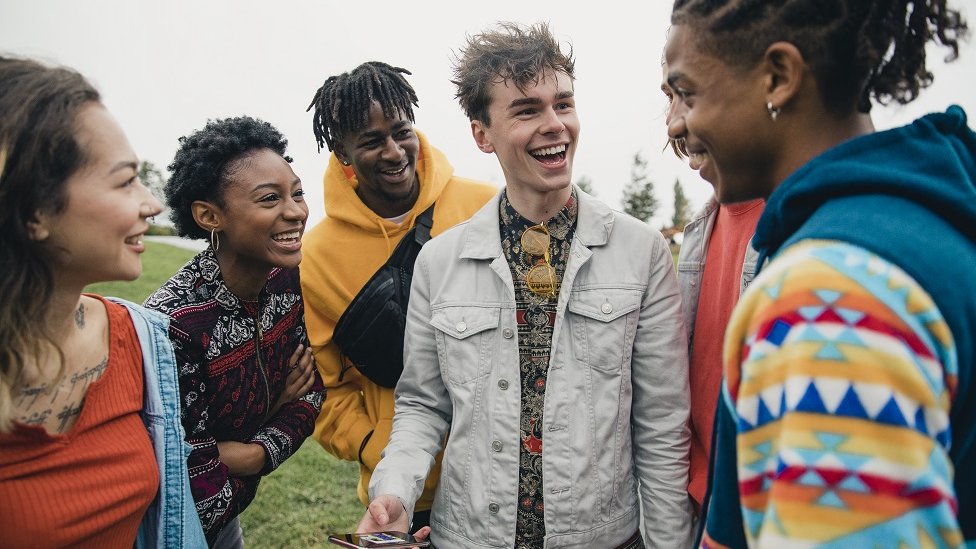 Kako se raspravljati sa rasistom: Pet oborenih mitova 5 Small group of young friends are hanging out in a public park.