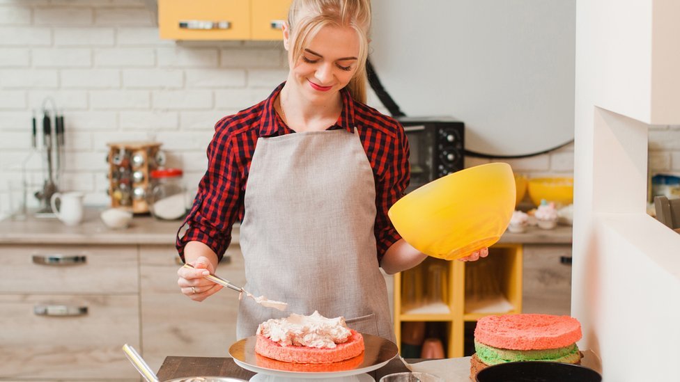 A woman baking a cake