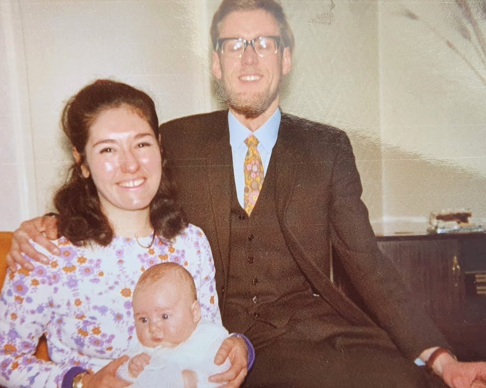 Kathleen and Bernie Webb with me in a Christening gown