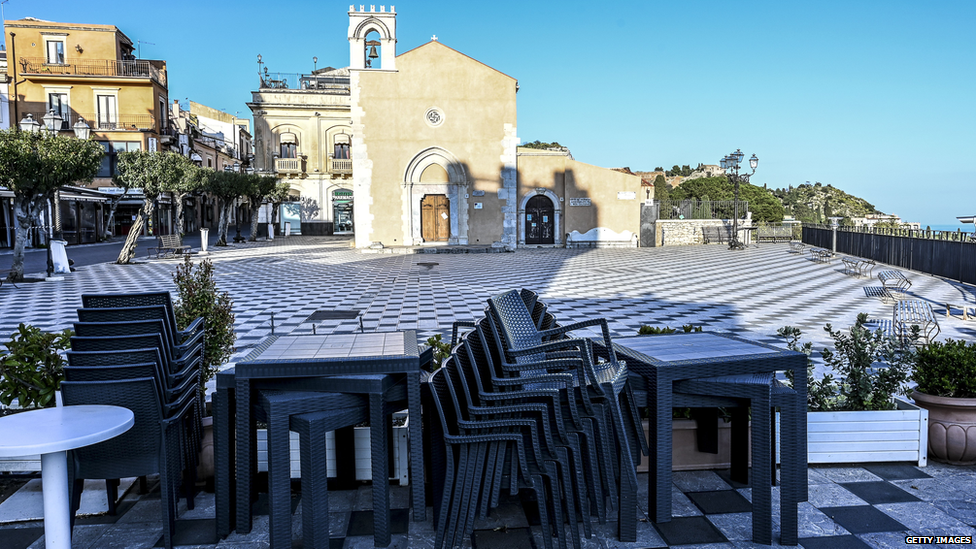 Empty tables at a closed restaurant in Sicily, after government restrictions to avoid the spread of Covid-19