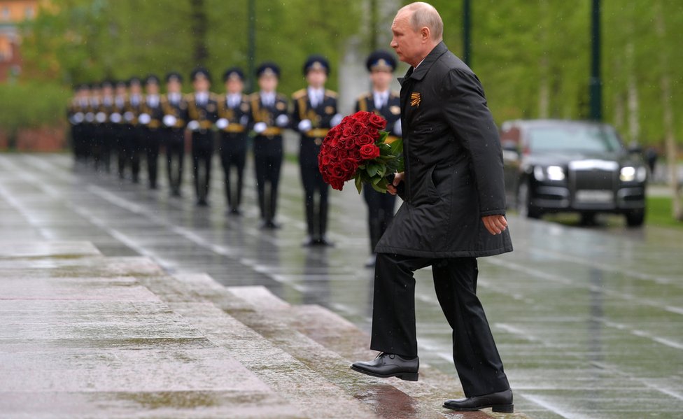 Russia's President Vladimir Putin lays flowers at the Tomb of the Unknown Soldier