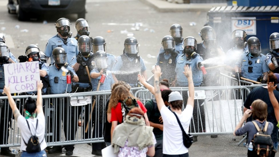 People gather at the Minneapolis Police Department's Third Precinct station on Wednesday