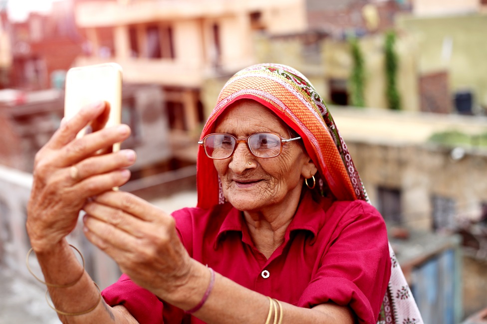 Old woman using a smartphone.