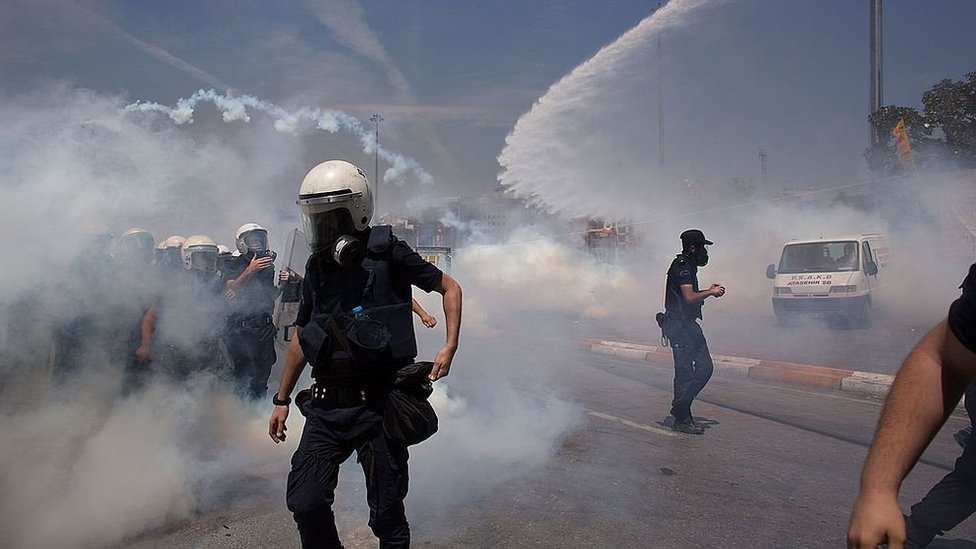 Riot police use water cannons and tear gas to disperse the crowd during a demonstration near Taksim Square n Istanbul, Turkey in 2013.