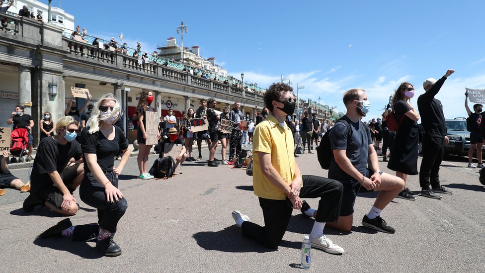 Protesters from Black Lives Matter took part in a silent vigil on Brighton Pier
