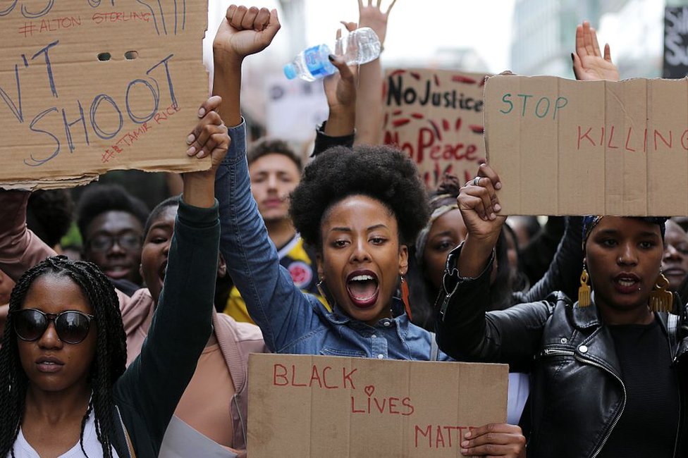 Demonstrators from the Black Lives Matter movement march through central London on July 10, 2016, during a demonstration against the killing of black men by police in the US. Police arrested scores of people in demonstrations overnight Saturday to Sunday in several US cities, as racial tensions simmer over the killing of black men by police.