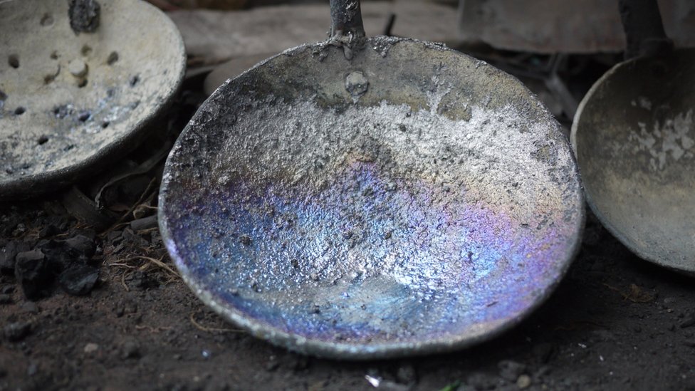 A utensil corroded by lead at a lead acid battery recycling factory in Patna, in India's Bihar state.