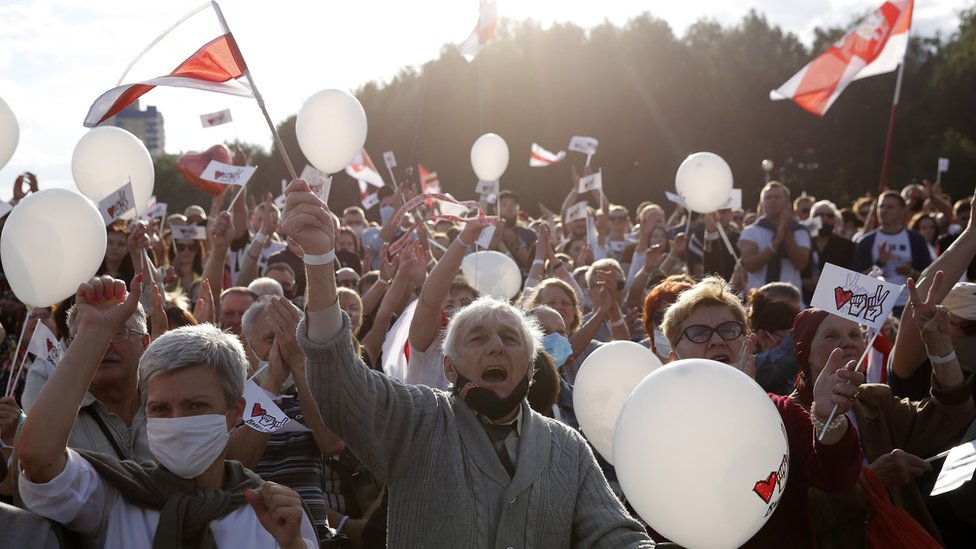 People attend a campaign rally of the Belarusian opposition presidential candidate