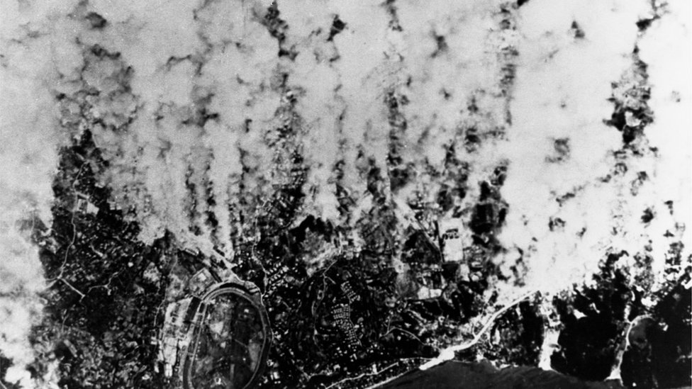 Columns of smoke rise from Yokohama during an air raid in March 1945