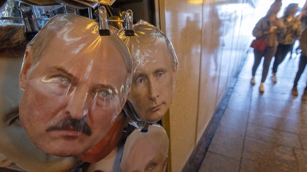 Masks of Belarus President Alexander Lukashenko (L) and Russian President Vladimir Putin displays on the street souvenir market in St. Petersburg, Russia, 15 August 2020.