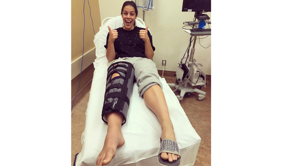 Ms Russo in hospital with her leg in a cast