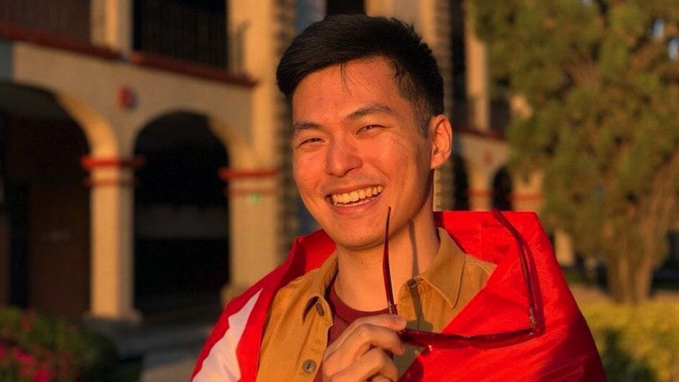 Eugene Cheow pictured in front of Universidad de las Américas Puebla (UDLAP) wrapped in the Singapore flag