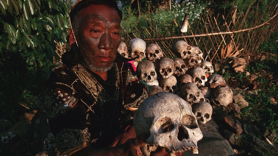 A Naga chief shows a collection of skulls secretly hidden under stones in 1998, despite an order from the Indian government to destroy them