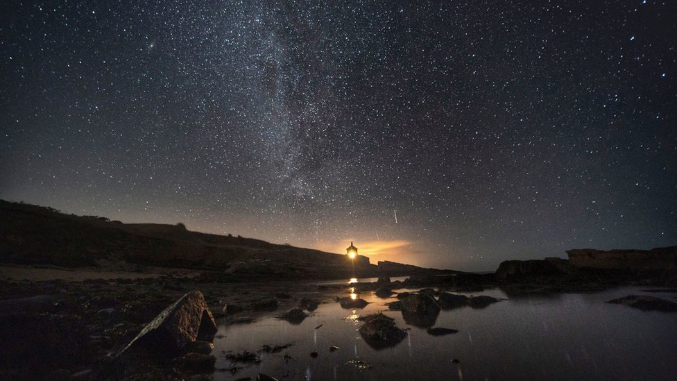 The Milky Way - the galaxy that contains our Solar System - seen above the Bathing House in Howick, Northumberland