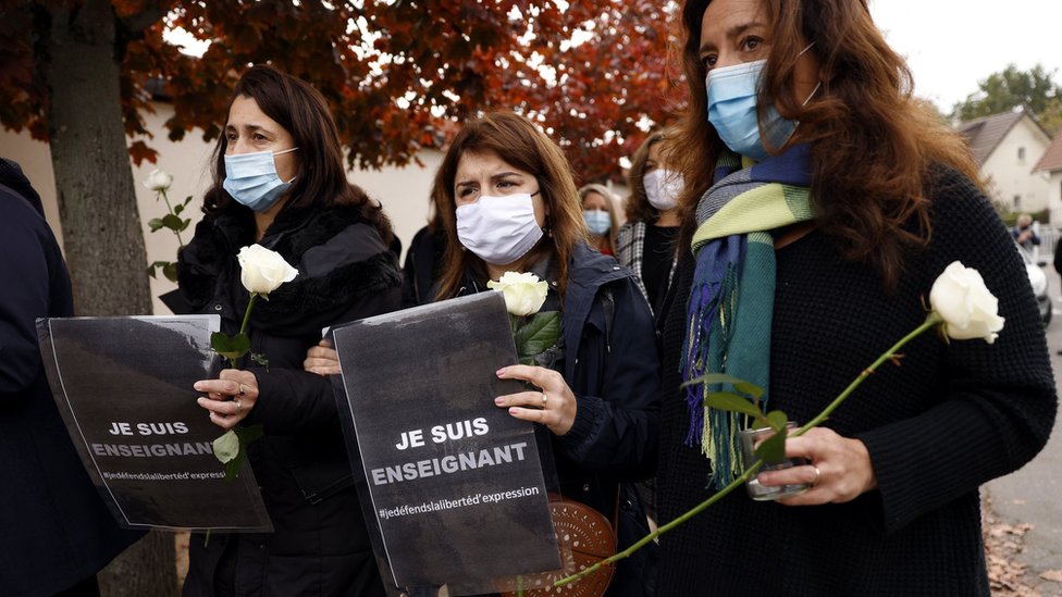 Teachers demonstrate outside the school after the murder of Samuel Paty