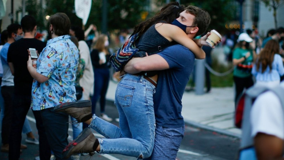 People hug as they celebrate in Philadelphia