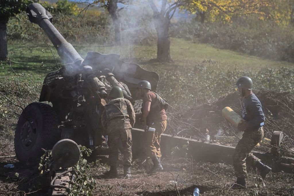 Armenian soldiers fire artillery on the front line on October 25, 2020