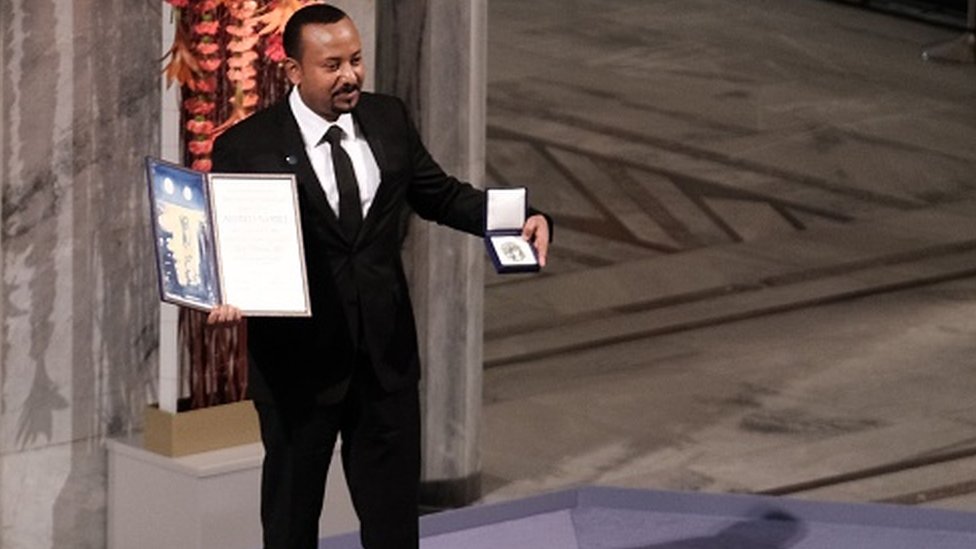 Ethiopia's Prime Minister Abiy Ahmed Ali poses after being awarded with the Nobel Peace Prize