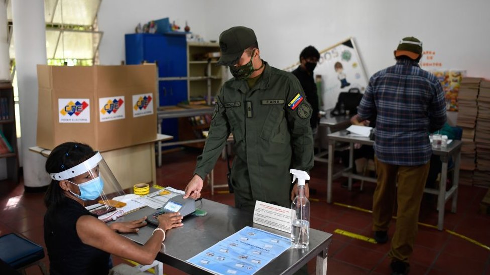 A Venezuelan soldier votes at a polling station in Caracas, on December 6, 2020